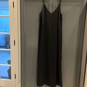 A new day slip dress, adjustable straps, side slit, midi length black dress
